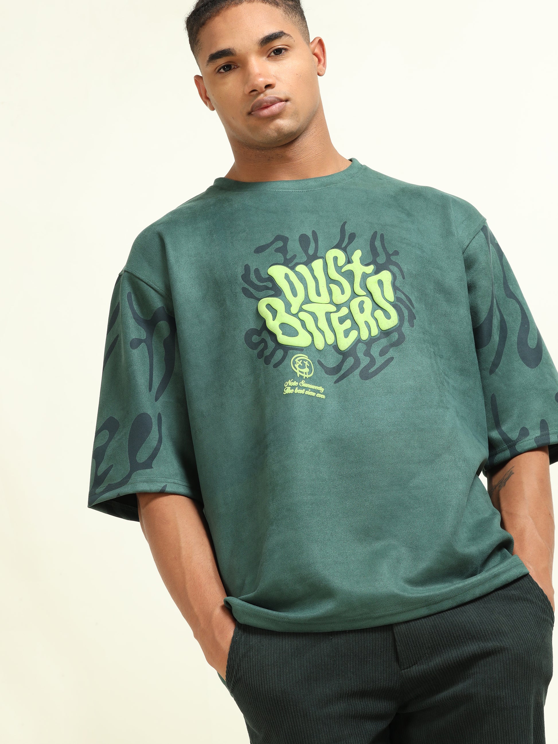 Side profile of a model wearing the Green Puff Print Casual T-shirt, highlighting the relaxed fit